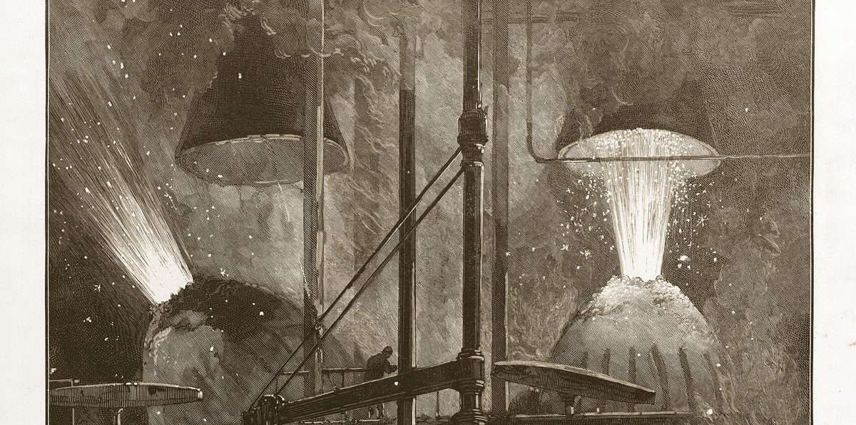 Two Bessemer converters blowing in a Pittsburgh steel mill, sparks rising to the roof; a wood engraving drawn by Charles Graham for Harper’s Weekly, April 10, 1886. Library of Congress.